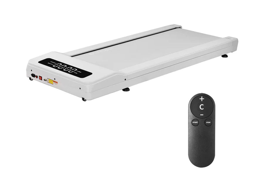 White under-desk treadmill with digital display and black remote control on white background