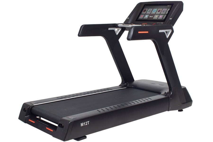Black commercial treadmill with touch screen console, orange accent trim, and cushioned running deck on white background