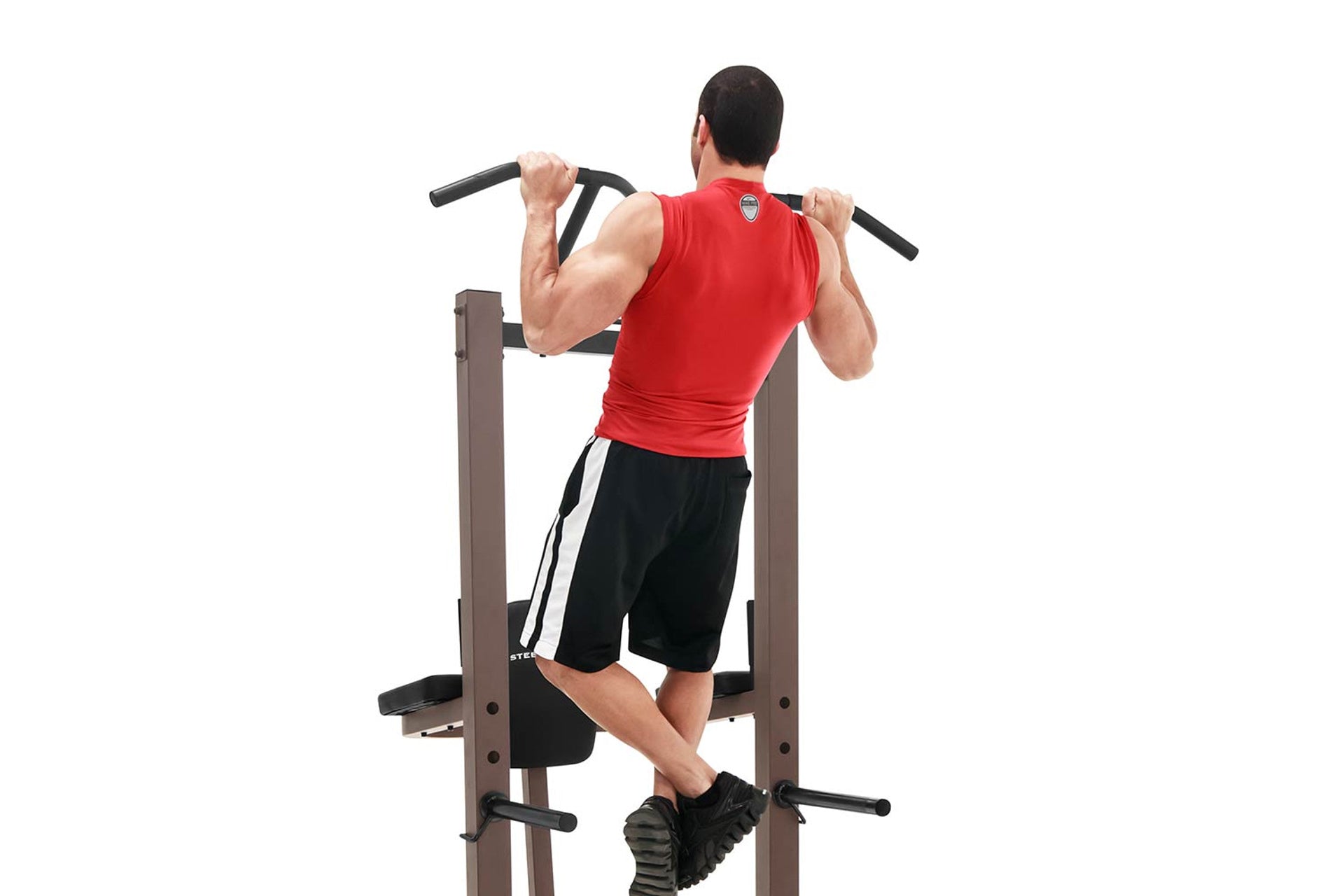 Warrior VKR/Dip Power Tower with man performing dip exercise in red sleeveless shirt, viewed from behind