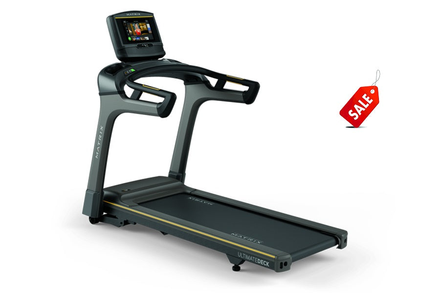 Matrix TF30 folding treadmill with gray and black frame, black running deck, and digital display console on white background