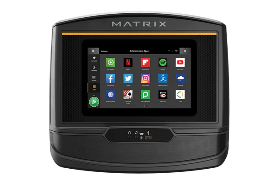 Matrix C50 Climbmill display console showing entertainment apps on touchscreen, black with orange accent stripe