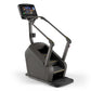 Matrix C50 Climbmill with black frame, digital touchscreen display showing workout metrics, and gold accents on footplates, o