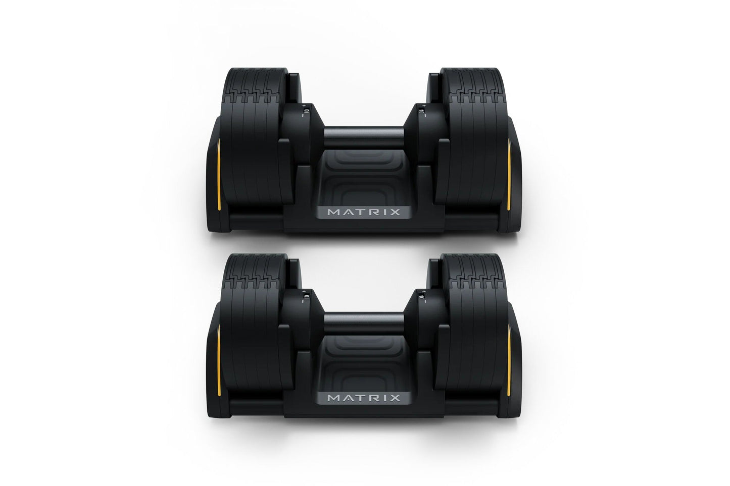 Pair of black Matrix adjustable dumbbells with yellow accents and textured grip handles, displayed on white background