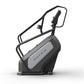 Matrix Endurance ClimbMill with black frame, gray console, and dual handles on white background