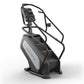 Matrix Endurance ClimbMill stair stepper machine with black frame, gray and white front panel, digital console, and dual hand
