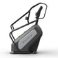 Matrix Endurance ClimbMill with black frame, gray accents, and adjustable handles on white background