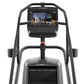 Matrix ClimbMill stair stepper with gray frame, black touchscreen display showing landmarks interface, and yellow accent deta