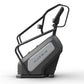 Matrix Endurance ClimbMill with black frame, gray console panel, and dual handlebar arms on white background