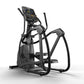Black and gray elliptical machine with digital console display, dual handles, and footpads on white background