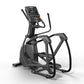 Black elliptical exercise machine with digital console displaying workout metrics, handlebars, and foot pedals on white backg