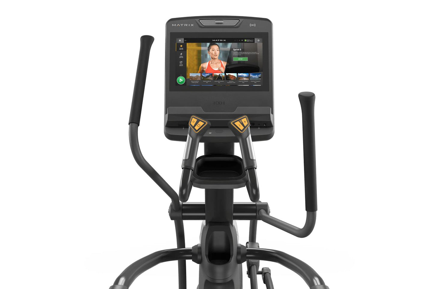 Matrix Endurance Elliptical with black frame, dual handles with yellow grips, and touchscreen console displaying fitness app,