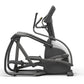 Matrix Endurance elliptical machine with black frame, white seat, curved handles, and digital console on white background