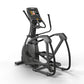Black elliptical machine with digital touchscreen display, dual handles, and foot pedals on white background