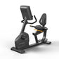 Matrix Endurance recumbent exercise bike with black frame, digital console, padded seat and backrest, on white background