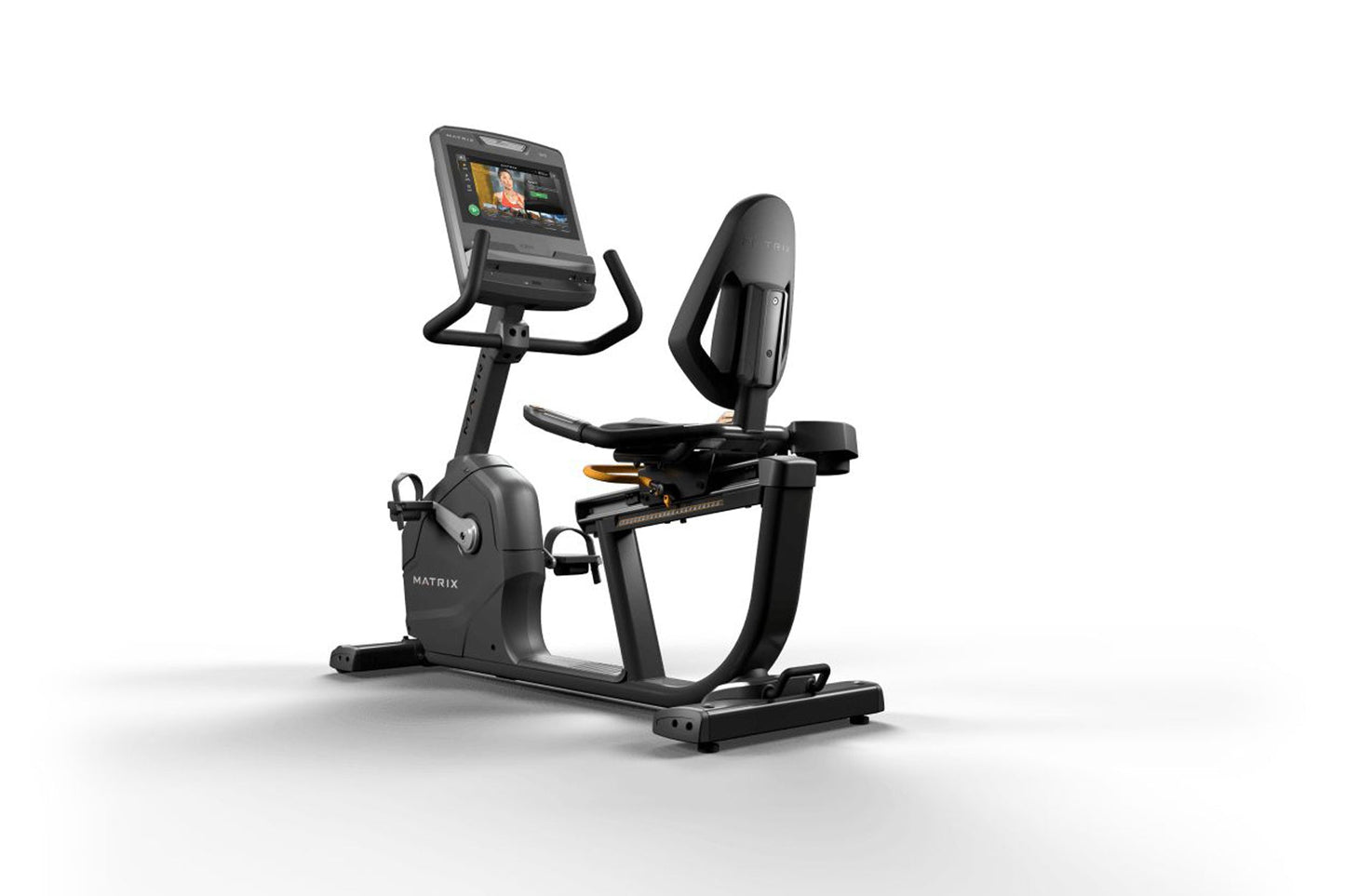 Matrix black recumbent exercise bike with digital touchscreen display, padded seat, and handlebar grips on white background