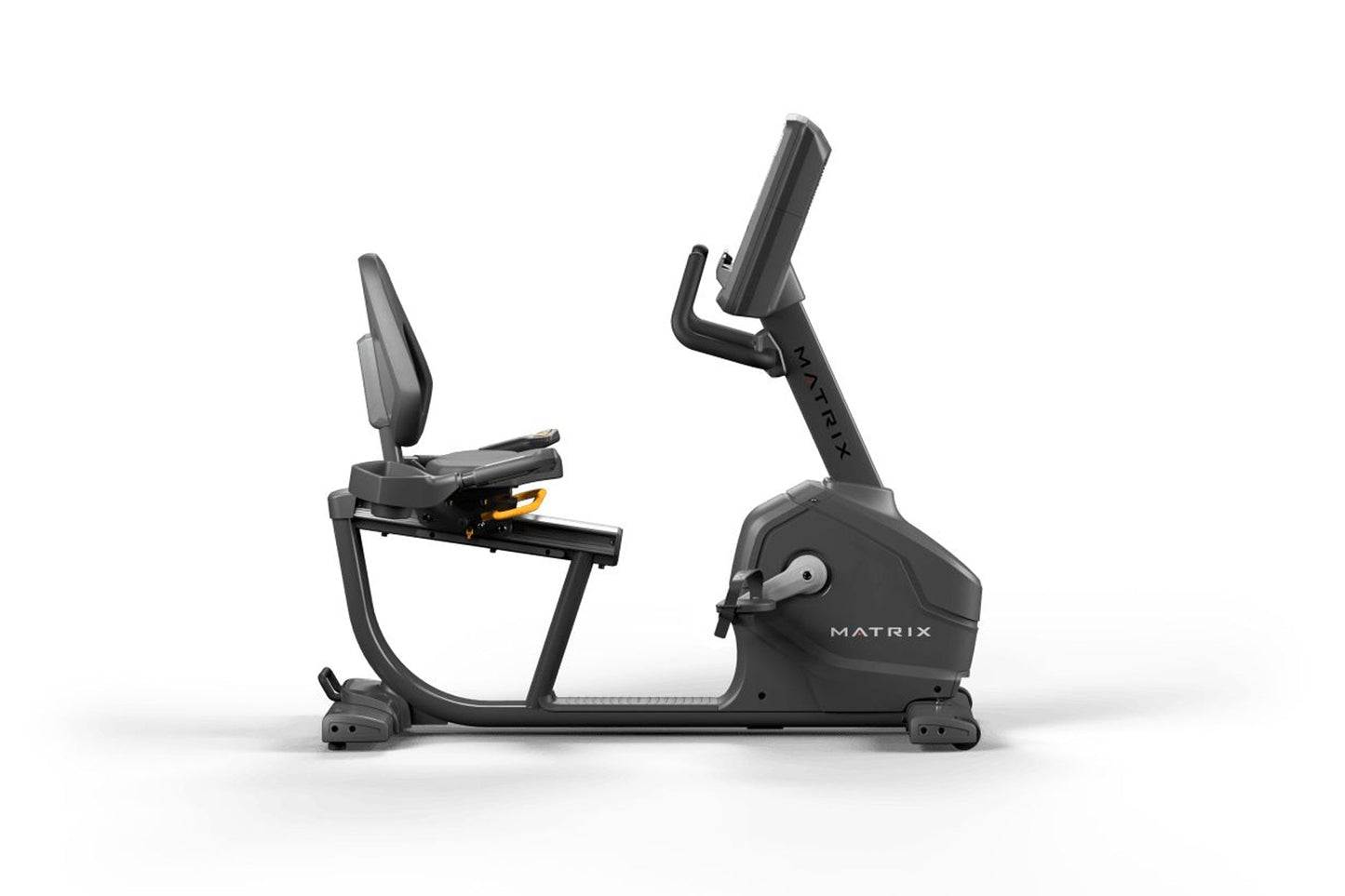 Matrix Endurance recumbent exercise bike with black frame, padded seat, digital display, and adjustable handlebars on white b