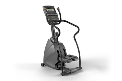 Black and gray commercial stepper machine with digital console displaying workout metrics, dual handles, and foot pedals on w