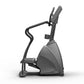 Matrix Endurance Stepper exercise machine with black and gray frame, curved handles, and digital console on white background