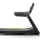 Black Matrix commercial treadmill with digital console, adjustable incline, and yellow accent stripe on running deck, side vi