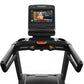 Matrix Endurance Treadmill with black frame, dual cup holders, red accent buttons, and touchscreen display showing fitness co