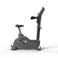 Matrix Endurance upright exercise bike with gray frame, black seat, and digital console on white background