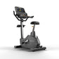 Matrix Endurance upright exercise bike with gray frame, black seat, handlebars, and digital display console on white backgrou
