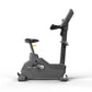 Matrix Endurance upright exercise bike with gray frame, black seat and handlebars, on white background