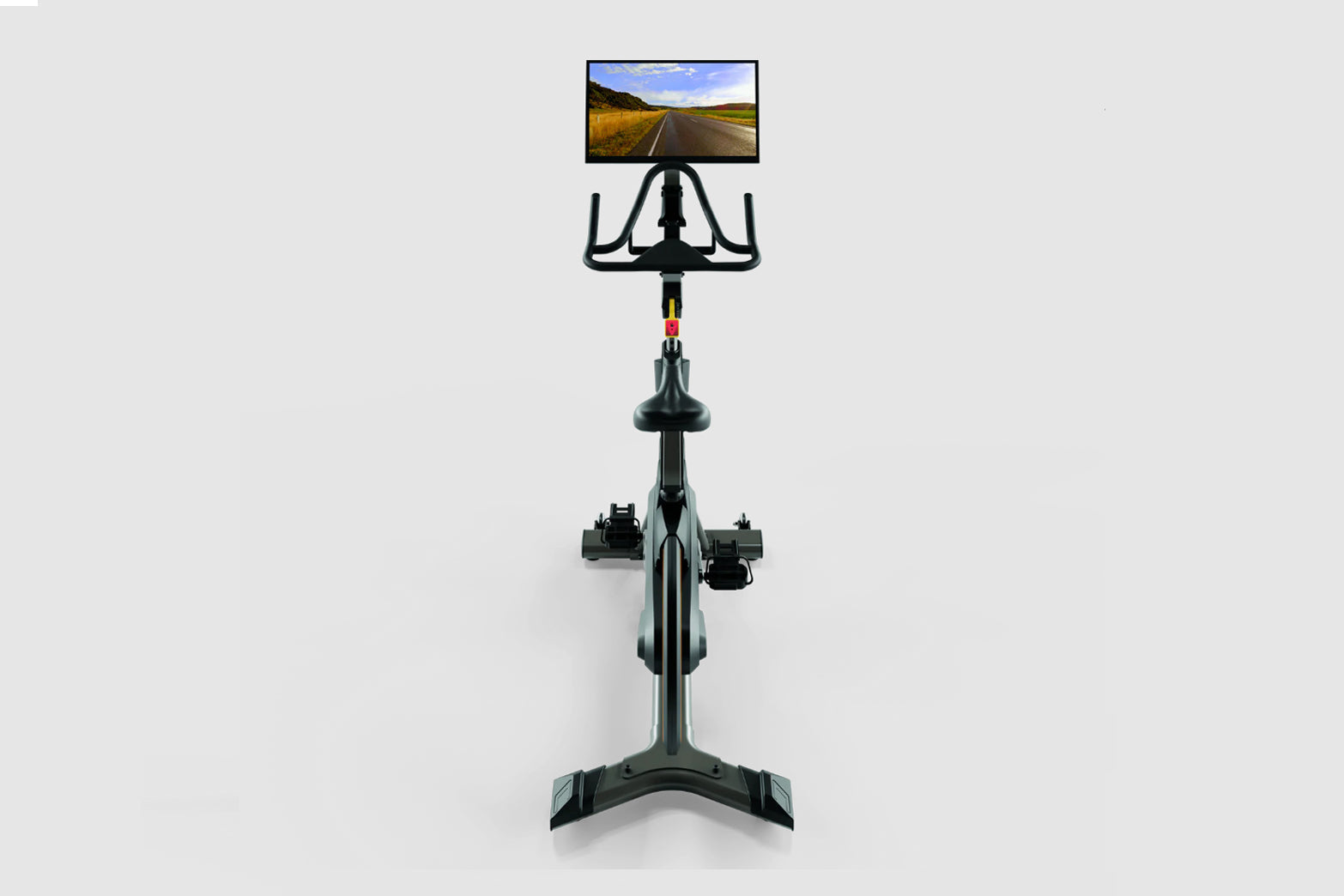 Black stationary indoor exercise bike with tablet mount displaying road landscape, viewed from front on white background