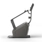 Black upright exercise bike with curved frame and digital display, shown from the side on white background