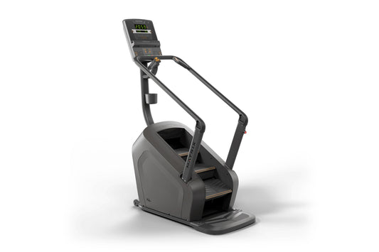 Black stair climbing exercise machine with digital display console showing calorie count and bronze accents on steps, on whit
