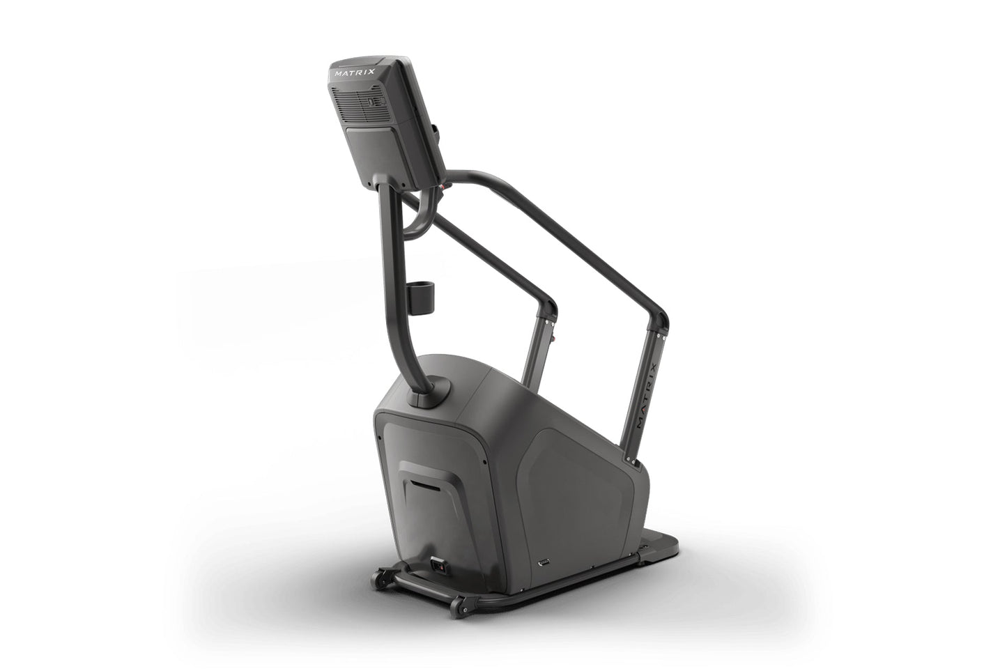 Matrix Lifestyle ClimbMill stair climbing exercise machine with dark gray frame, digital display console, and handrails on wh