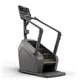 Matrix Lifestyle ClimbMill stair climbing machine with gray and black frame, digital display console, and dual handles on whi