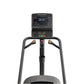 Matrix Lifestyle ClimbMill with digital console displaying workout metrics, black frame with gray handles, and foot platform 