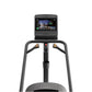 Matrix Lifestyle ClimbMill with black frame, dual handles with gold accents, and digital display console on white background