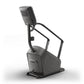 Matrix Lifestyle ClimbMill stair climber machine with gray and black frame, digital display console, and handlebar grips on w