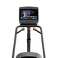 Matrix Lifestyle ClimbMill with touchscreen display showing workout interface, gray frame, and dual handles with gold accents