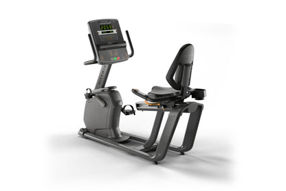 Matrix black and gray recumbent stationary exercise bike with digital display console showing fitness metrics and heart rate 
