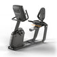 Matrix Lifestyle recumbent exercise bike with black seat, digital display console, and orange accents on white background