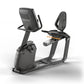 Matrix black recumbent exercise bike with digital display console, backrest, and orange resistance lever on white background