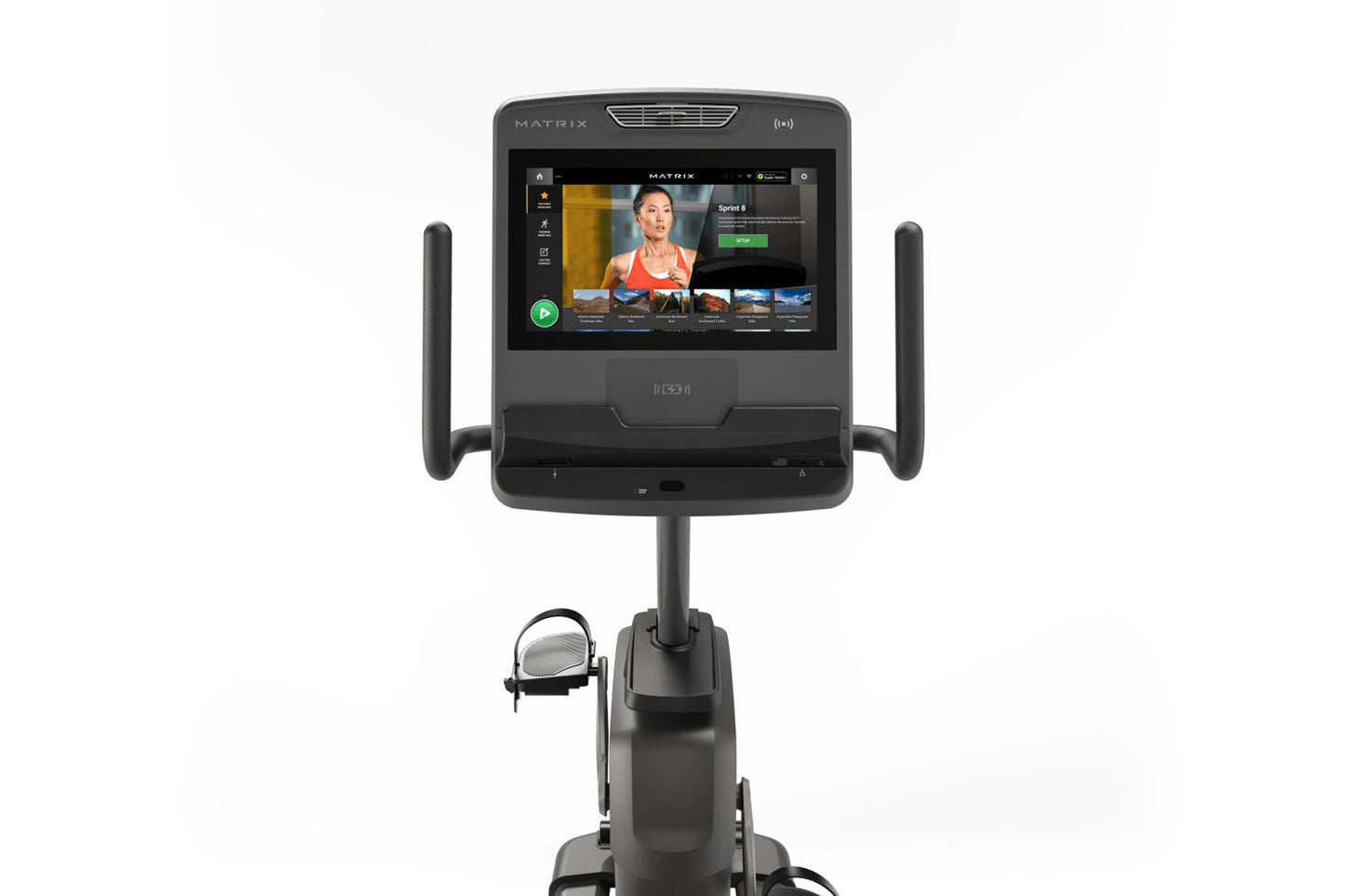 Matrix Lifestyle Recumbent Cycle with black frame, large touchscreen console displaying fitness app, and dual handlebar grips