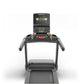 Matrix Lifestyle treadmill with digital console display showing speed and metrics, black frame with gray accents, viewed from