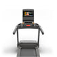 Matrix treadmill with black and gray frame, digital touchscreen console displaying fitness video, and red accent lighting on 