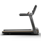 Matrix Lifestyle black treadmill with digital console and orange accents, viewed from side angle on white background