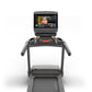 Matrix Lifestyle Treadmill with integrated touchscreen display showing fitness class content, gray frame with dual handles an