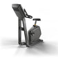 Matrix upright exercise bike with black frame, digital display console, padded seat, and handlebars on white background