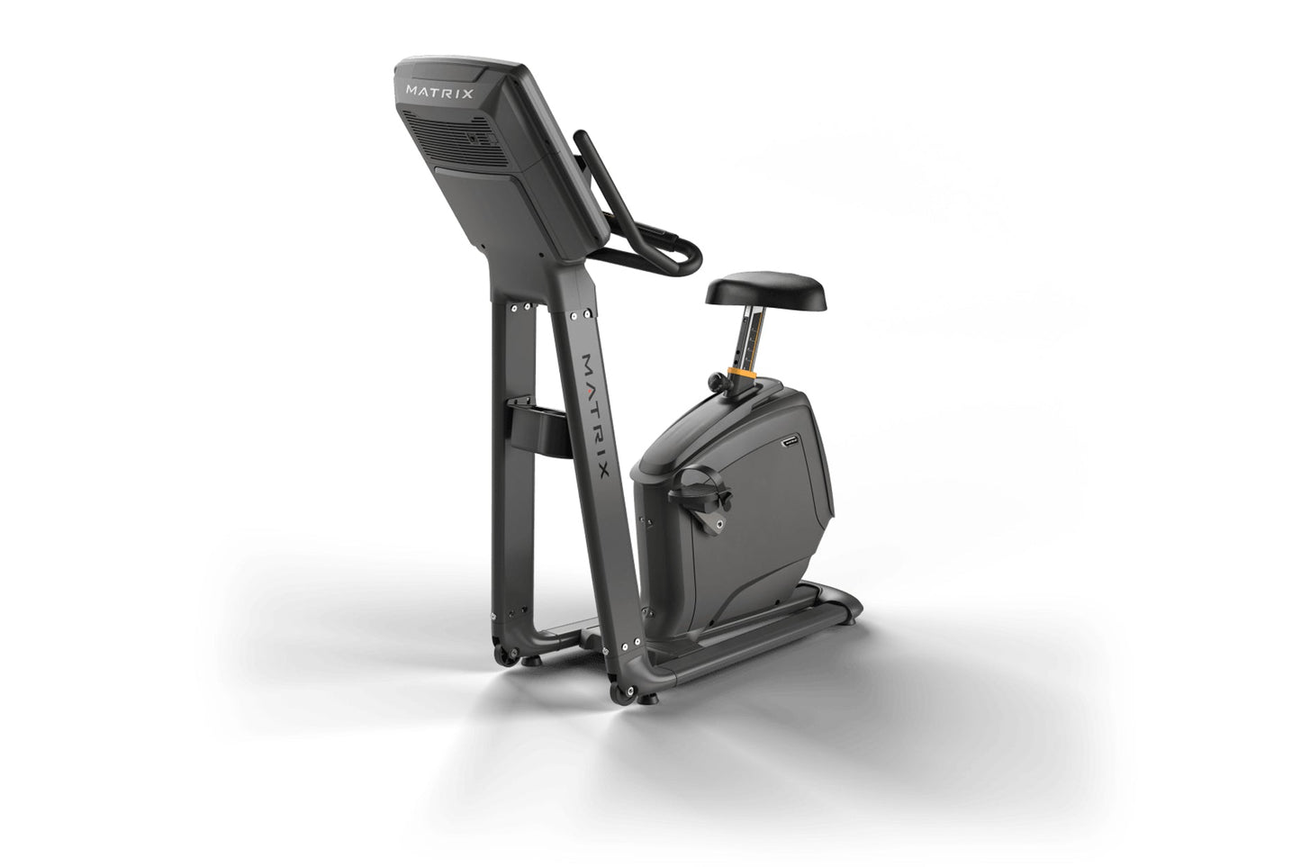 Matrix upright exercise bike with black frame, digital display console, padded seat, and handlebars on white background