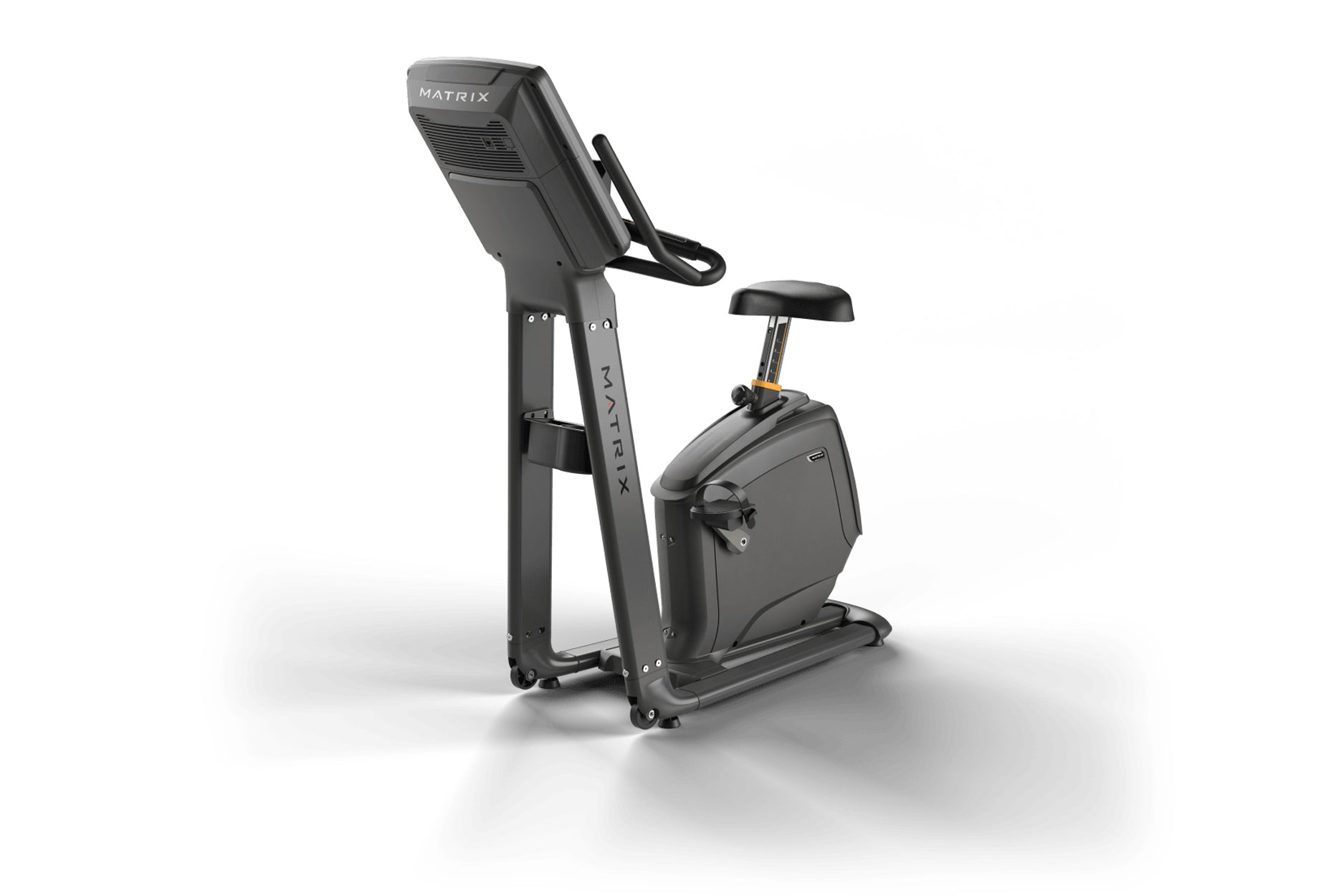 Matrix upright exercise bike with black frame, digital display console, padded seat, and handlebars on white background