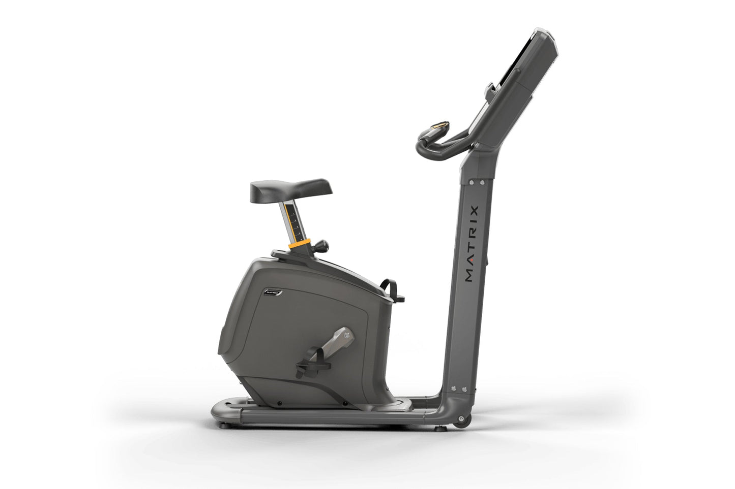 Matrix Lifestyle upright exercise bike with black frame, padded seat, vertical handlebar post, and gold accent trim on white 