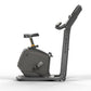 Matrix Lifestyle upright exercise bike with black frame, padded seat, and vertical handlebar display on white background