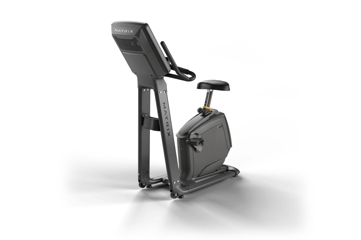 Matrix dark gray upright stationary bike with digital display console and black padded seat on white background
